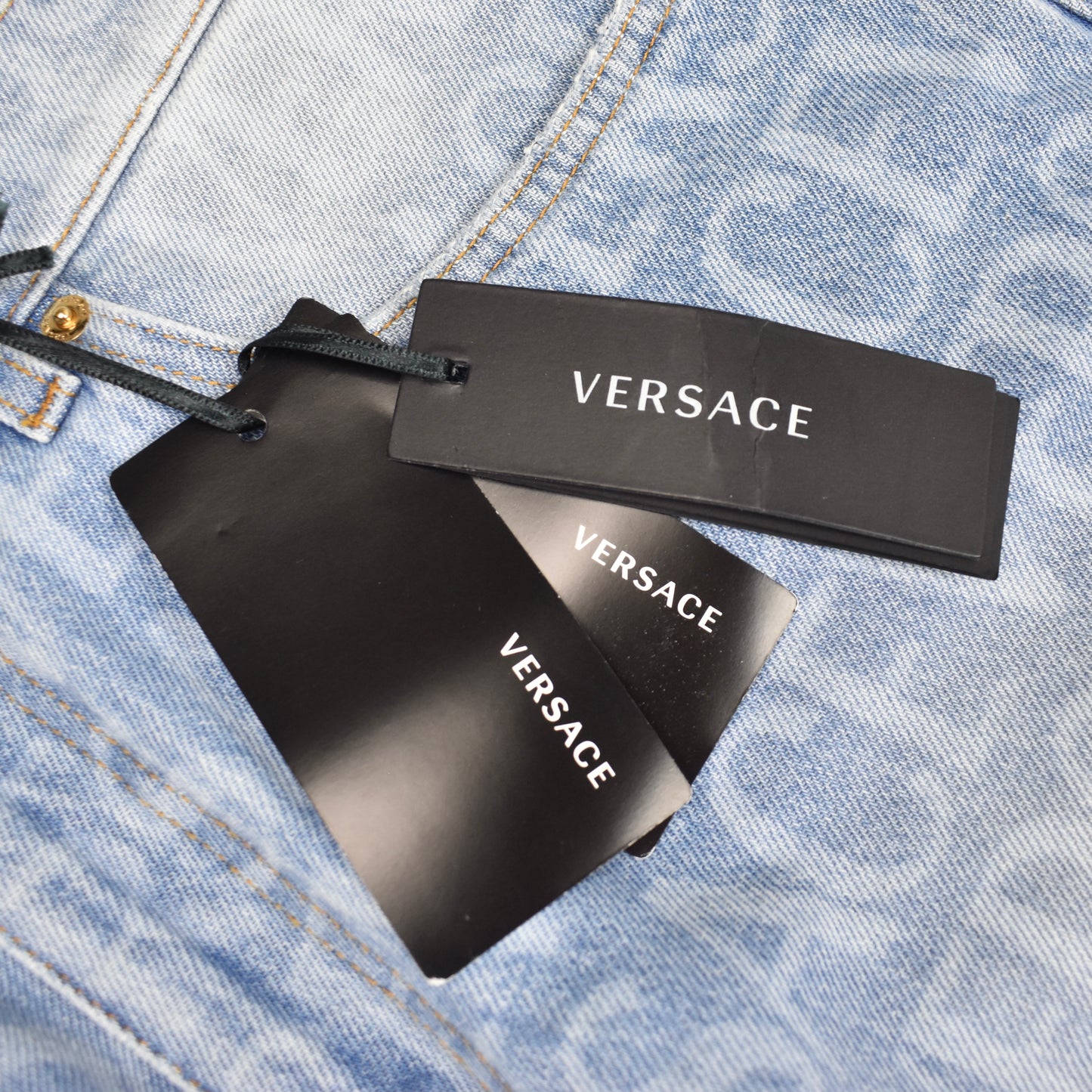 Versace - Allover Logo Print Light Wash Denim Jeans