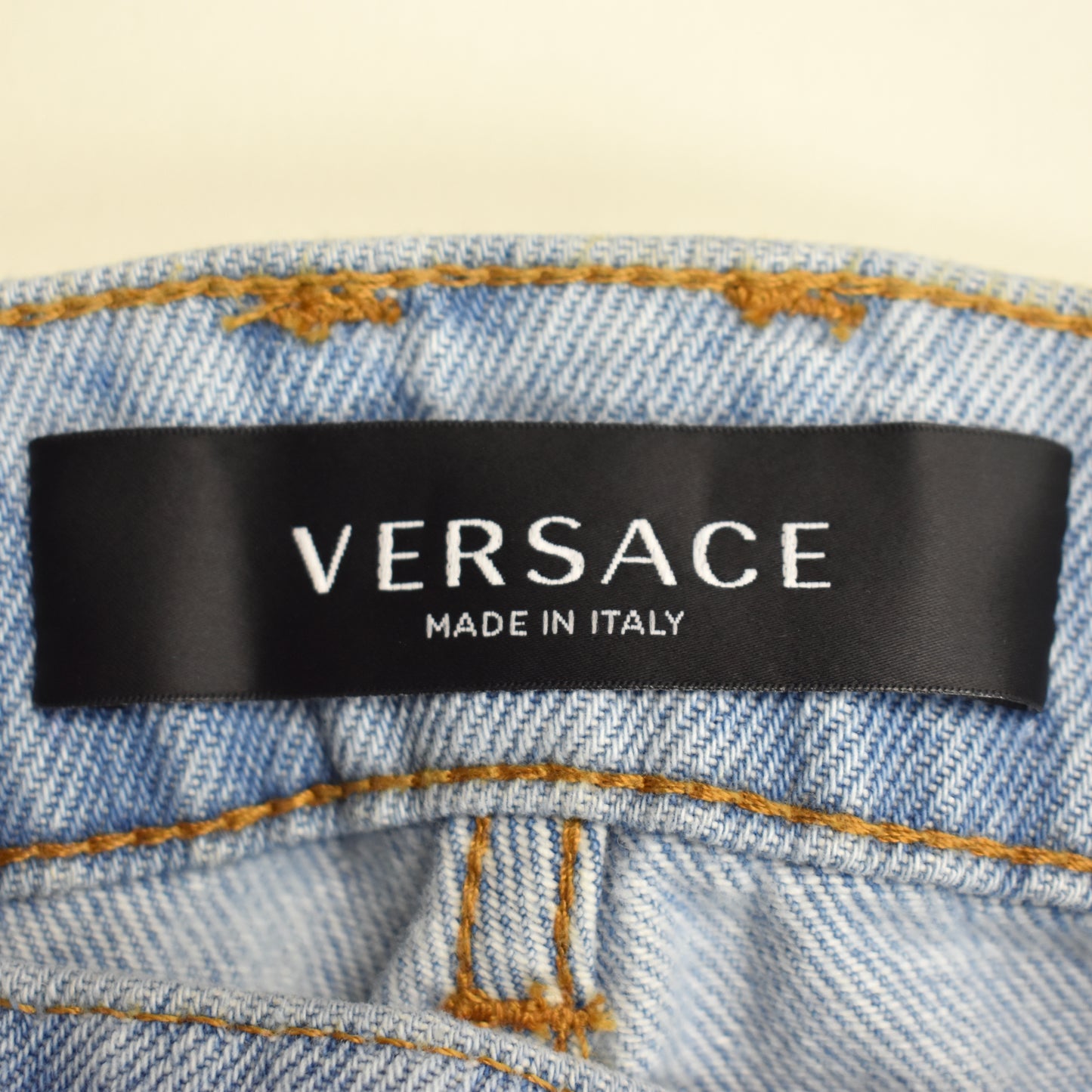 Versace - Allover Logo Print Light Wash Denim Jeans