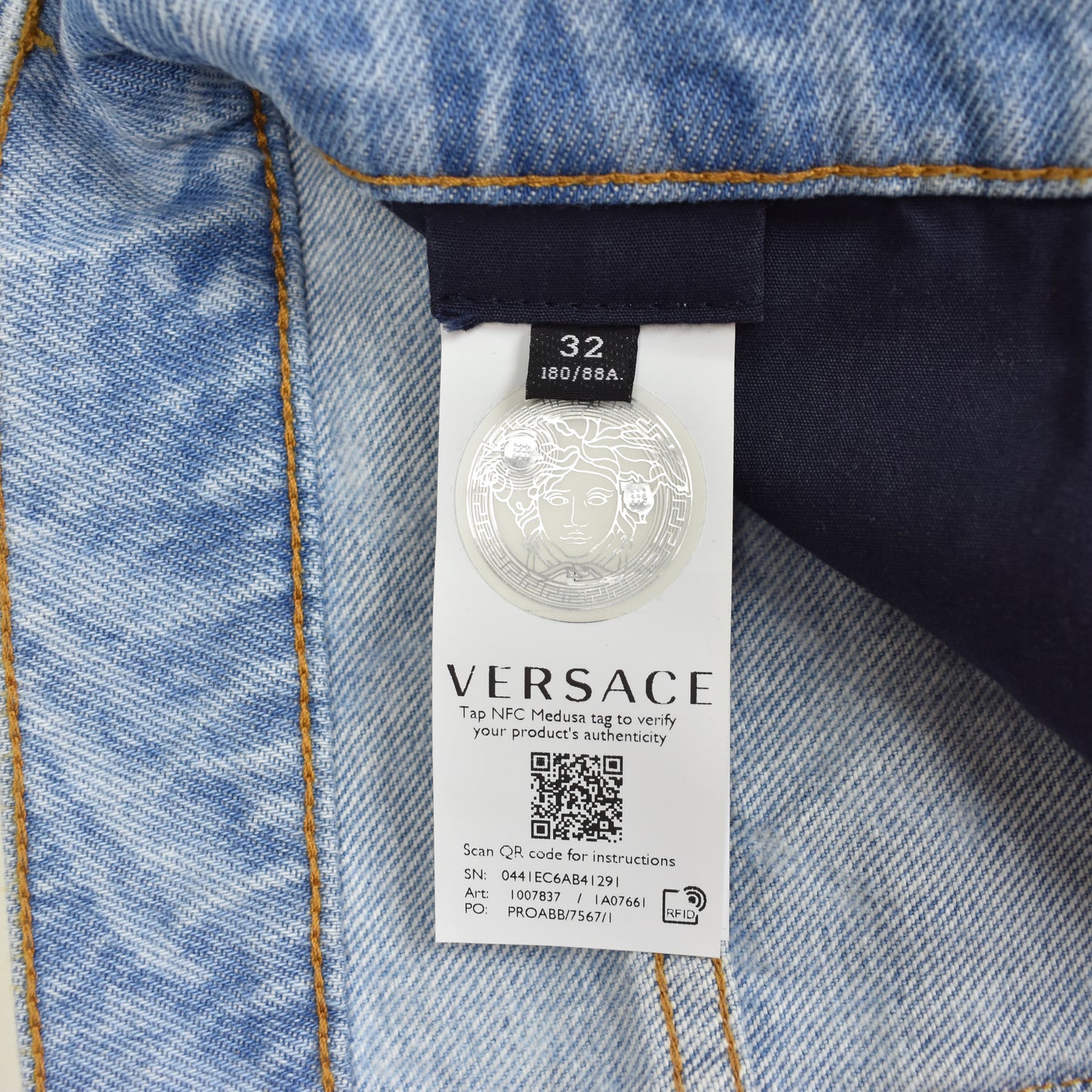 Versace - Allover Logo Print Light Wash Denim Jeans