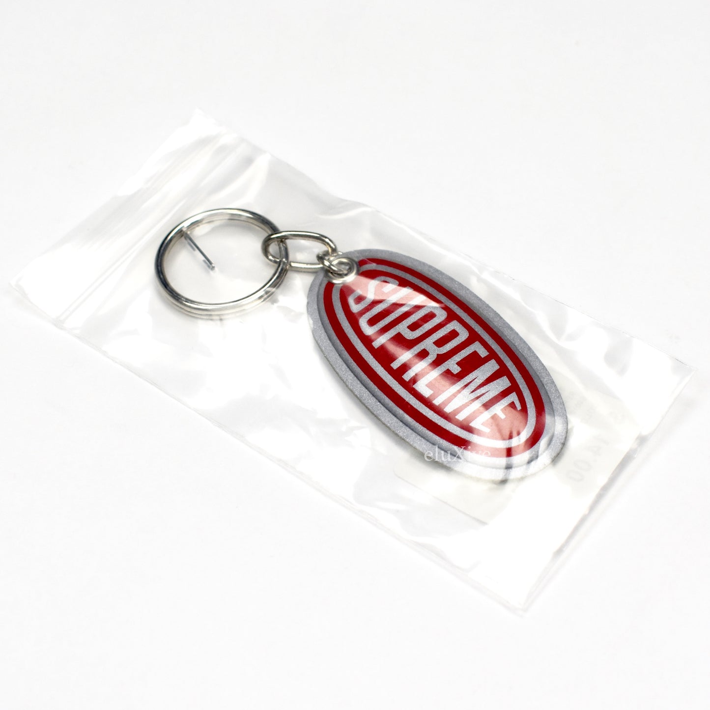 Supreme - Reflective Oval Logo Keychain