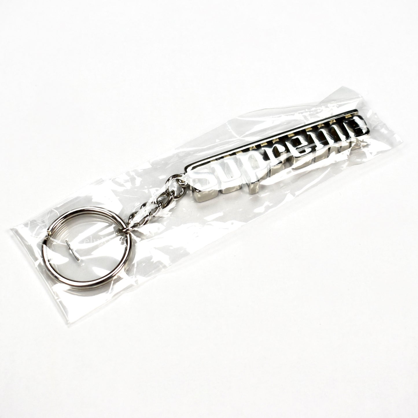 Supreme - Silver Grand Prix Logo Keychain