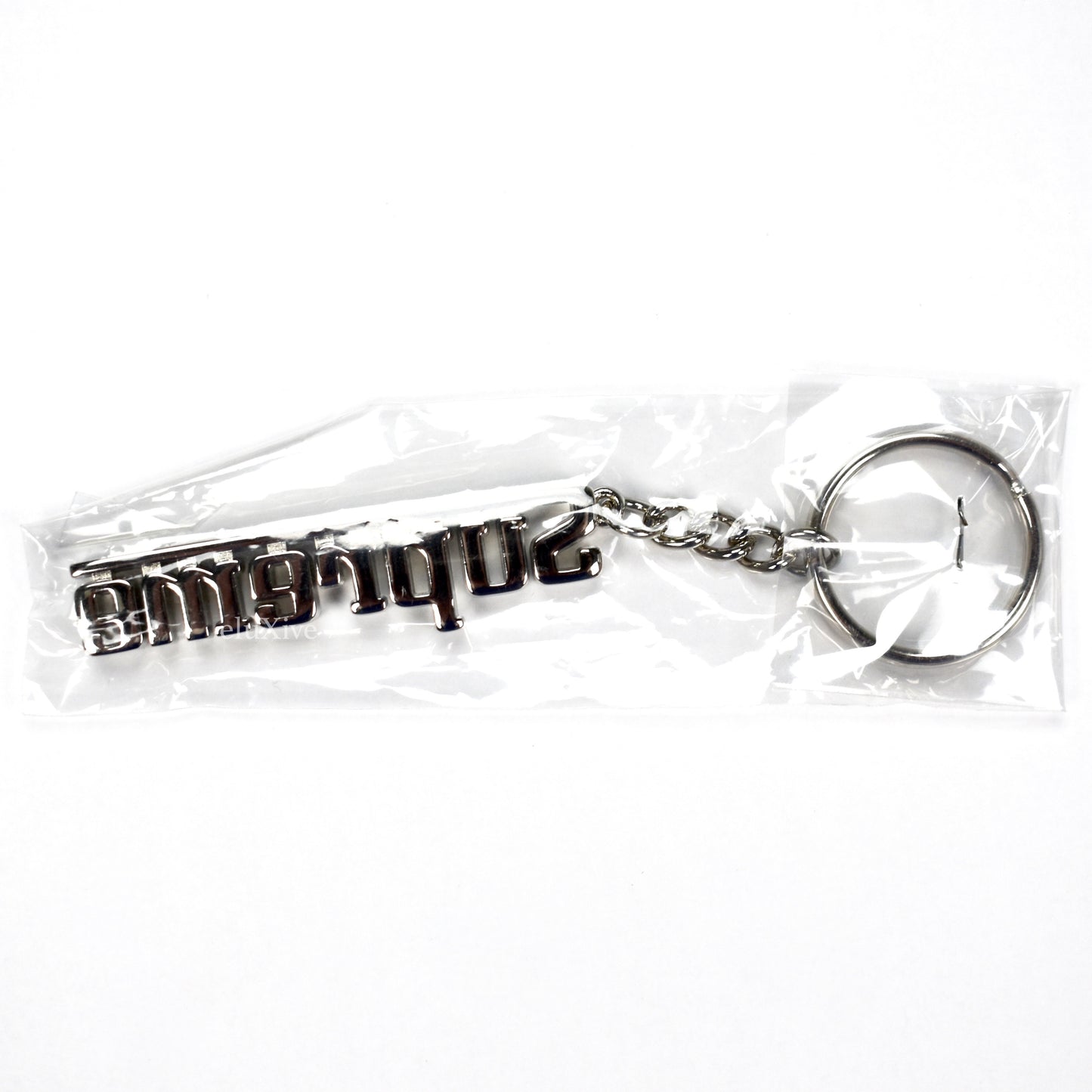 Supreme - Silver Grand Prix Logo Keychain