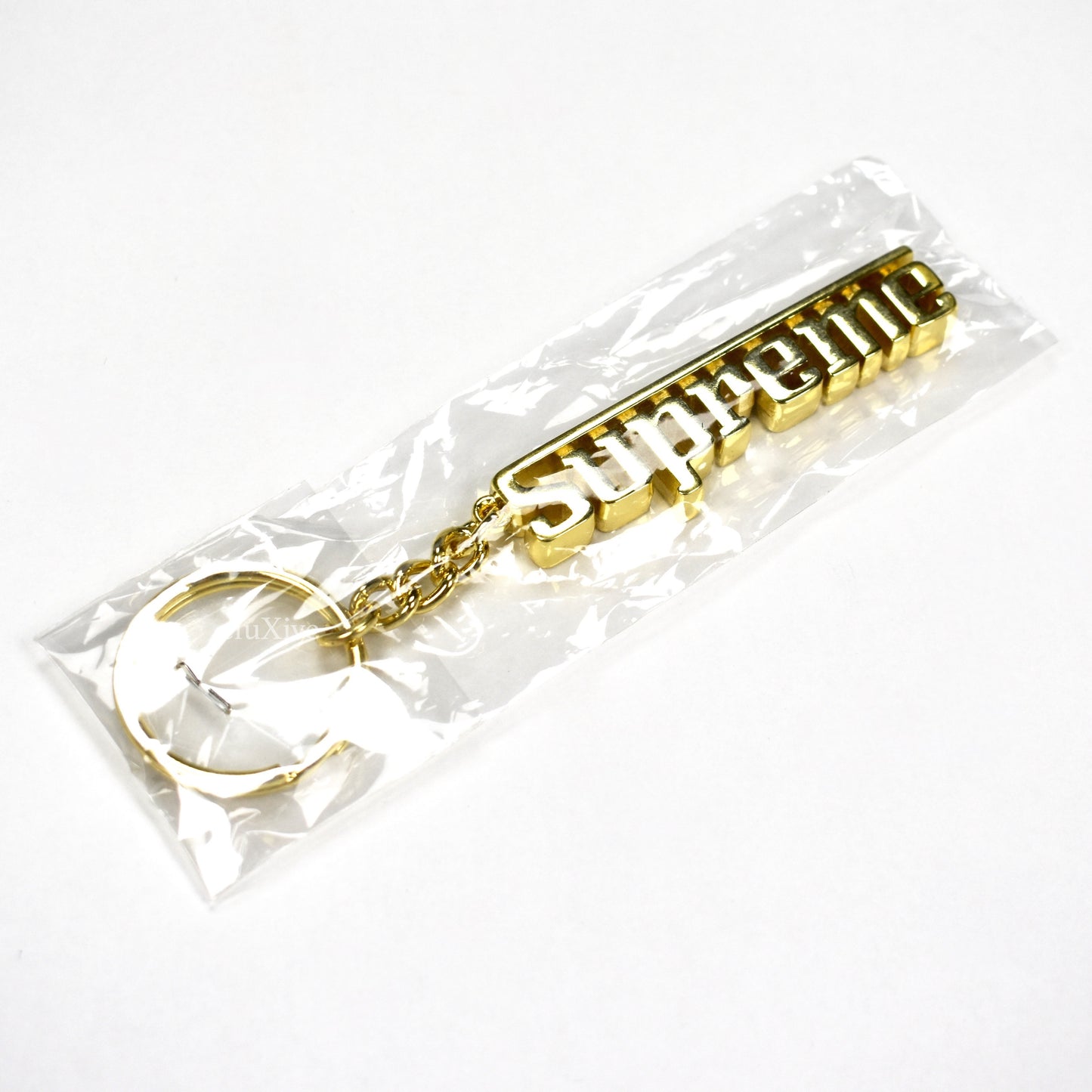Supreme - Gold Grand Prix Logo Keychain
