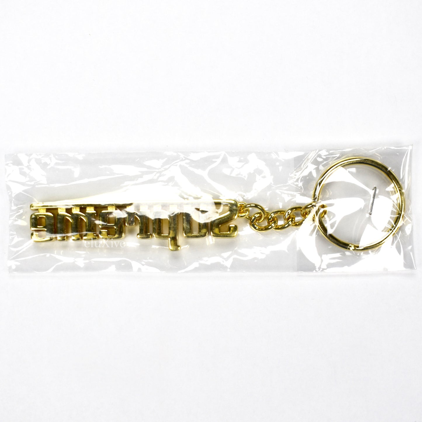 Supreme - Gold Grand Prix Logo Keychain